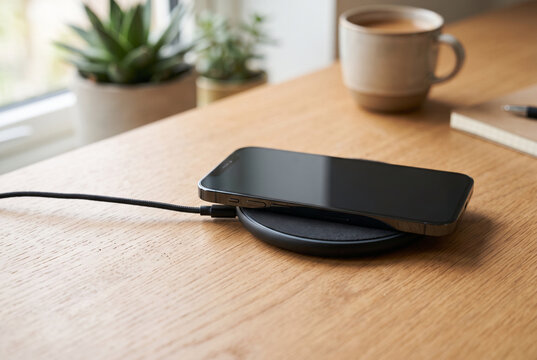 Wireless charging pad with a blank smartphone