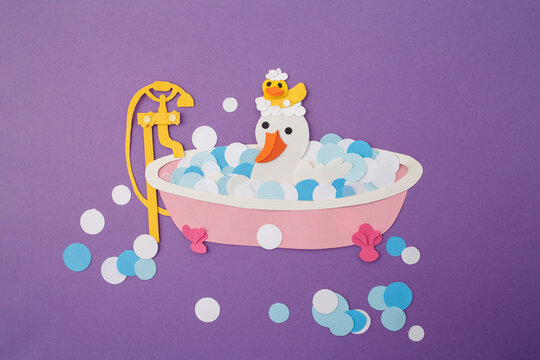 Paper cut goose in bath with bubbles on purple background, kids craft, flat lay, perfect for toy design, stationery brands, education publishers