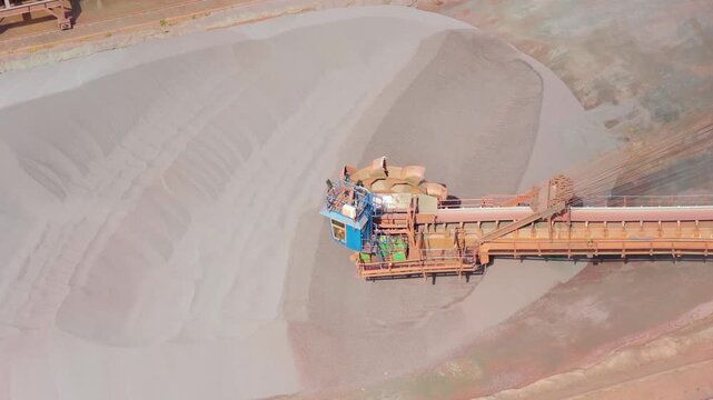 Large Industrial Stacker Machine Operating at an Iron Ore Mine Site