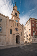 Obraz premium Low angle view of historic church and monastery of Saint Francis with bell tower under blue sky in Split old town, Dalmatia, Croatia