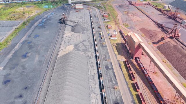 Aerial View of Heavy Machinery Moving Coal at an Industrial Site
