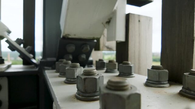 Close up of heavy steel bolts on industrial structure