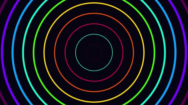 Vibrant neon glowing colorful concentric circles expanding outward in continuous motion for dynamic digital background video footage