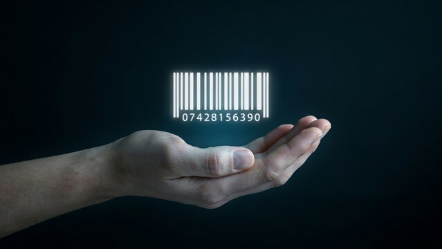  human hand holding glowing digital barcode representing product tracking and identification