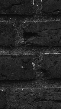 Rough dark brick wall texture pattern