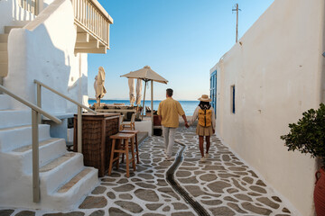 Fototapeta premium Romantic stroll along the charming streets of Naousa, Paros, Greece