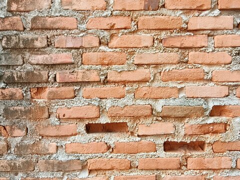 Old Rustic Red Brick Wall Texture with Weathered Mortar Background