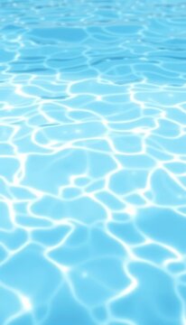 Soft blue waves undulate beneath the surface creating a serene atmosphere in a tranquil swimming pool setting, poolside, blue