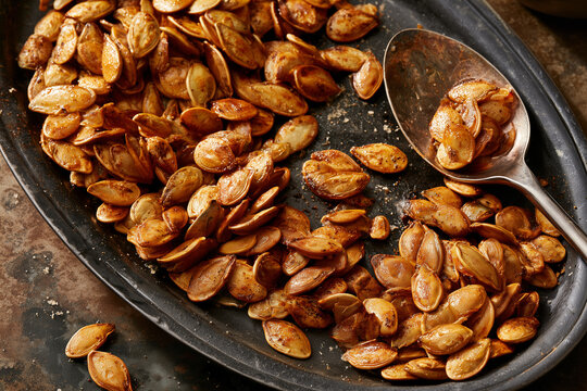 Crunchy roasted pumpkin seeds made from fresh pumpkin, celebrating the flavors of autumn as a nutritious and delicious seasonal snack