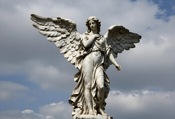 Fototapeta premium Spirituality and religion concept, marble angel statue with wings spread against a cloudy sky, divine protection and peace in historical architecture