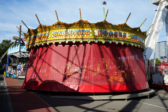 Victorian Galloping Horses carousel with curtains drawn at Goose Fair