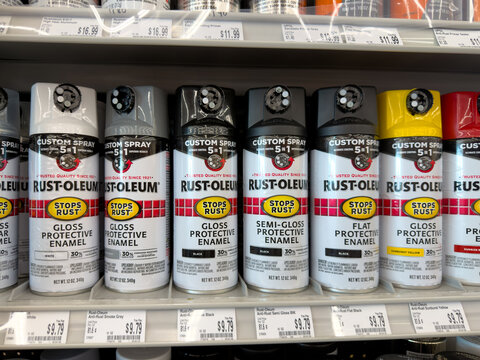 Aubrey, Texas, USA - September 22nd, 2026: Rust-Oleum custom spray 5 in 1 protective enamel paint cans displaying inside AutoZone store
