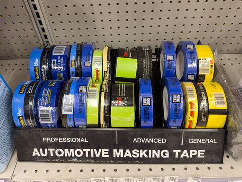 Aubrey, Texas, USA - September 22nd, 2026: Scotch blue and 3M automotive masking tape rolls displaying inside AutoZone store