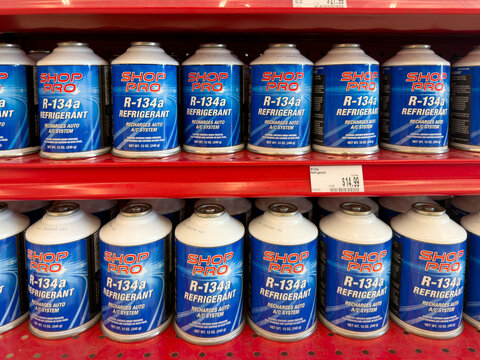 Aubrey, Texas, USA - September 22nd, 2026: Shop Pro refrigerant cans standing on retail shelf inside AutoZone store