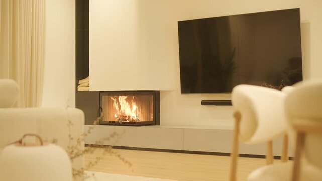 Cozy modern living room with a burning corner fireplace   
