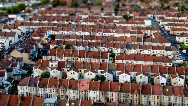 Aerial view of a dense terraced neighborhood in the UK at daytime.