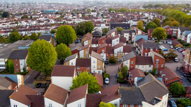 Aerial view of a dense residential neighborhood in a city.