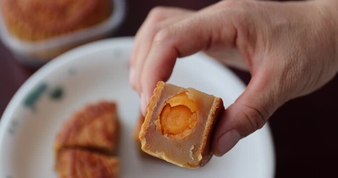 Two egg yolks white lotus seed paste mooncake. Traditional Chinese sweet dessert for celebrating the Chinese mid autumn festival