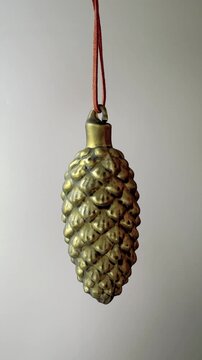Green Glass Pine Cone Ornament With Golden Lustre Vertical