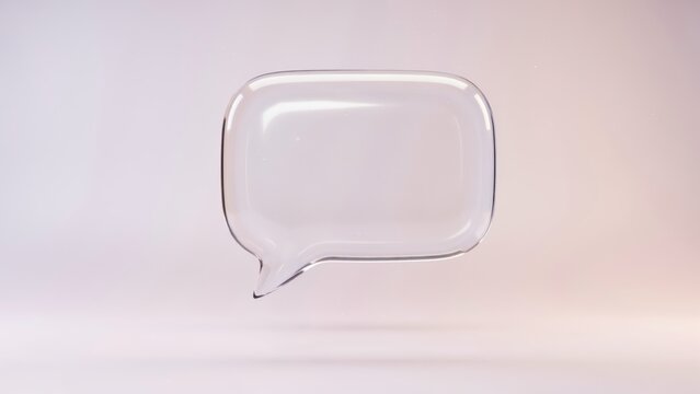 A clear glass speech bubble floats in a soft, ethereal background, perfect for communication concepts.