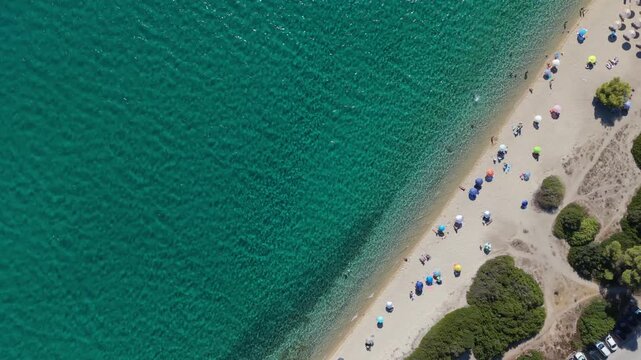 Top Down Drone View of Turquoise Beach with Small Boats