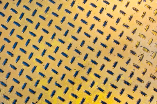 Yellow diamond plate metal texture background