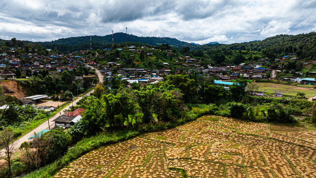 Aerial view of The entrance to Pang Ung Dam has rice terraces along the way, which looks beautiful and blends in with nature. Wat Baan Hai Makhuea Som is a temple and center of the local people.