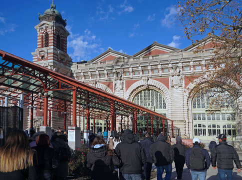 Tourists disembarking from the ferry at the Ellis Island Immigration Museum in New York