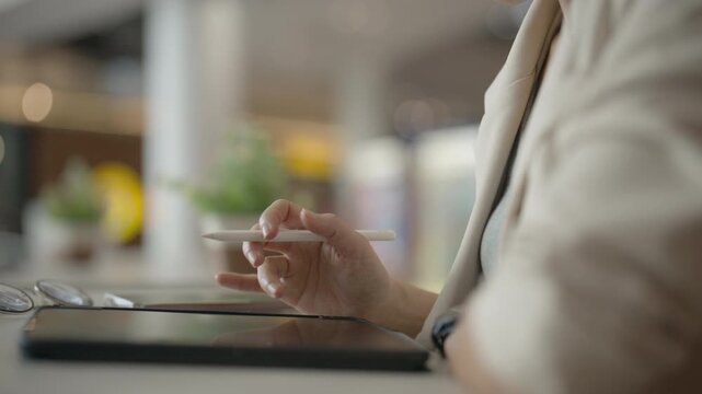 Business Professional Using Digital Tablet at Modern Office Desk