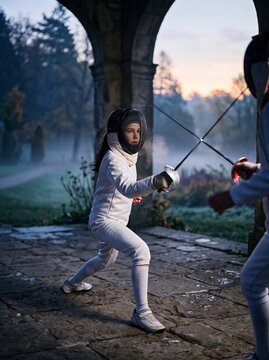 Young Girl Fencer Executing a Precise Sabre Parry at Dawn