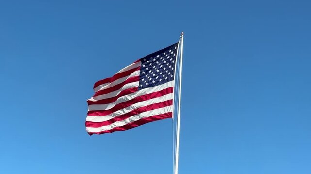 American Flag Against a Blue Sky wih Space for Copy