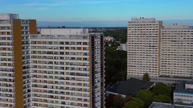 Solar panels on a prefabricated building in Marzahn. Dramatic aerial view drone