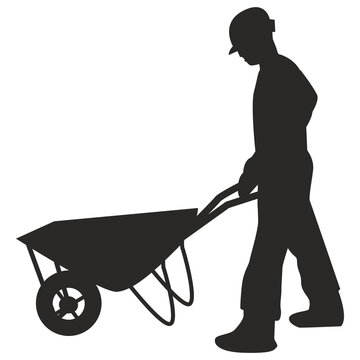 Worker pushing a wheelbarrow filled with dirt