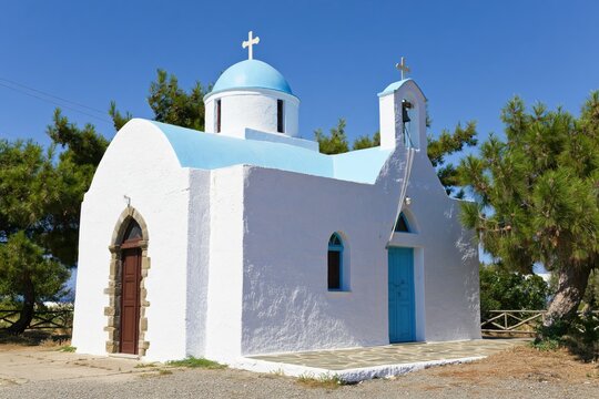 White church with blue dome and roof