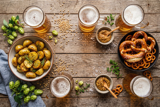 Overhead beer pretzel and roasted potato spread with copy space
