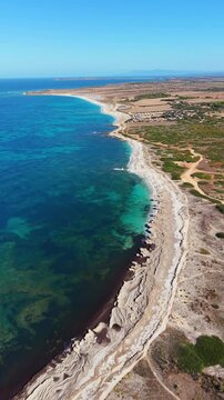  Scenic aerial drone flight landscape of Is Arutas beach, Oristano, Sardinia, Italy
