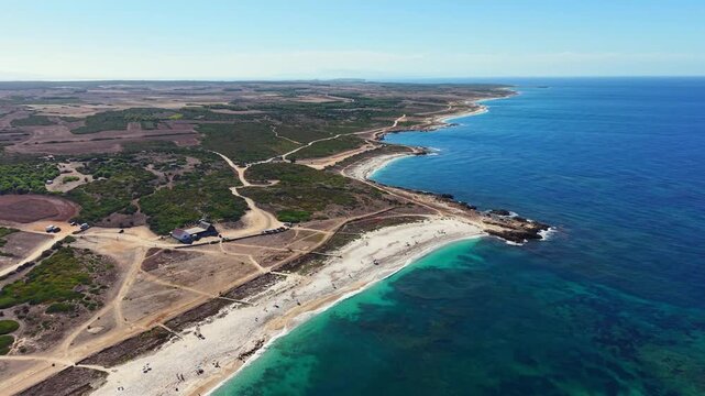  Scenic aerial drone flight landscape of Punta Bardoni, Is Arutas beach, Oristano, Sardinia, Italy
