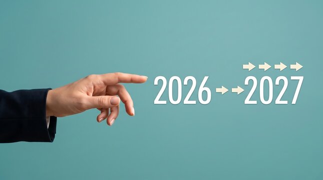 Business transition 2026 to 2027 concept, hand pointing to new year numbers with progress arrows, strategic planning future goal