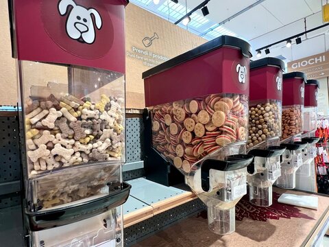 Eco friendly zero waste bulk dog treats and food dispensers at a pet store.