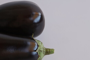 eggplants on a black background © Ana Maria