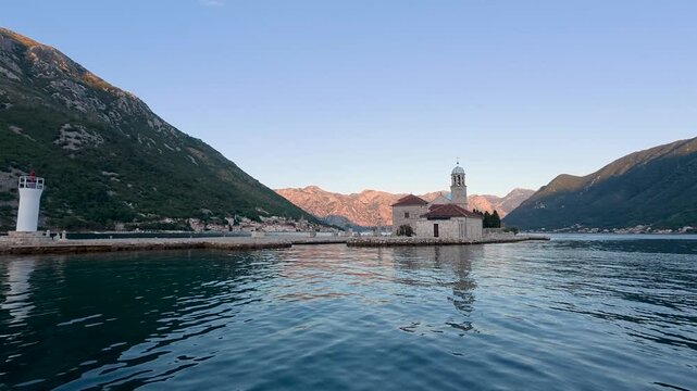 Our Lady of the Rocks church surrounded by mountains in Perast Kotor Bay