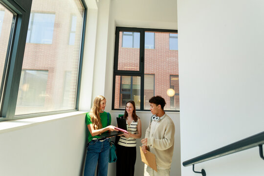 Business Meeting in an Office Hallway