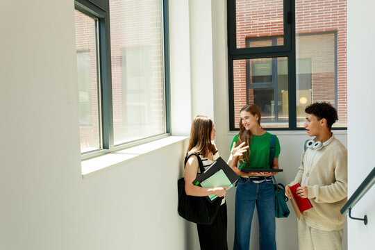 Students Talk and Share Ideas in a Hallway
