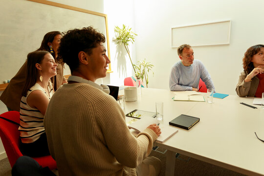 Group of People in a Meeting Room