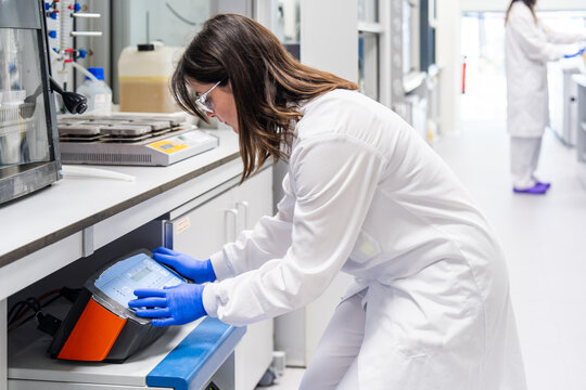 Scientist Working in Laboratory Using Scientific Equipment