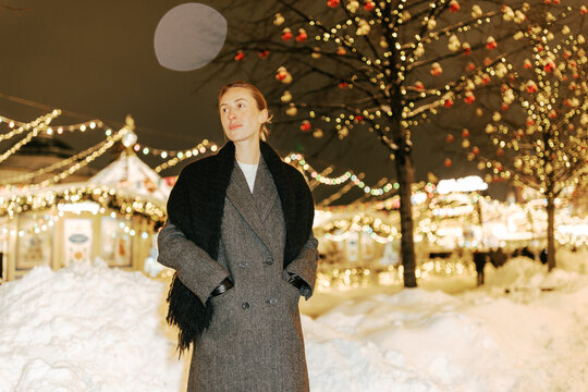 Winter Celebration in a Snowy Market at Night at Red Square in Moscow