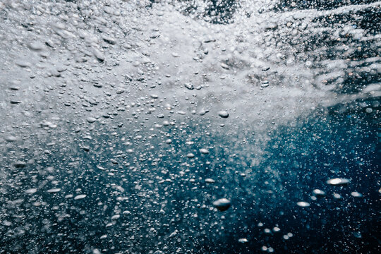 underwater bubbles swirling beneath the surface