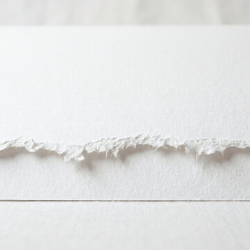 Detailed Macro Shot Of White Textured Handmade Paper With A Deckle Edge And Visible Fibers For Minimalist Stationery And Elegant Invitation Card Design