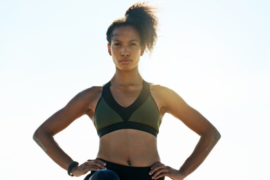 Thinking, athlete and woman with confidence outdoor for fitness, exercise and training ideas. Blue sky, female person and space for sports workout, cardio reflection or planning for marathon practice