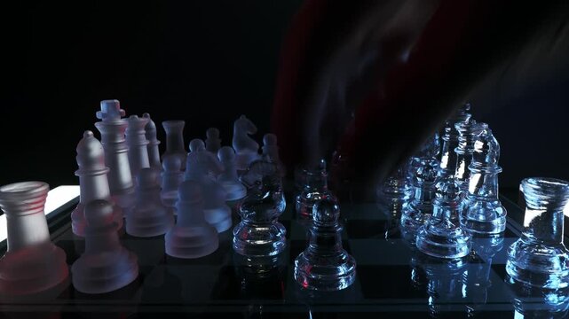 Fast-motion of players carefully replacing glass chess pieces on a transparent board to start a new match.